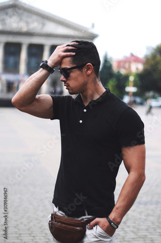  Guy in black polo and sunglasses.Business portrait.