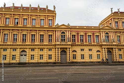 View of historical building in Potsdam  Germany with two cyclists