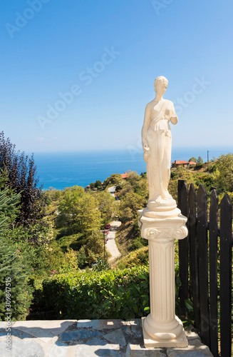 Palaios Panteleimonas in Greece - Olympic Coast . View on Aegean Sea with ancient sculpture.