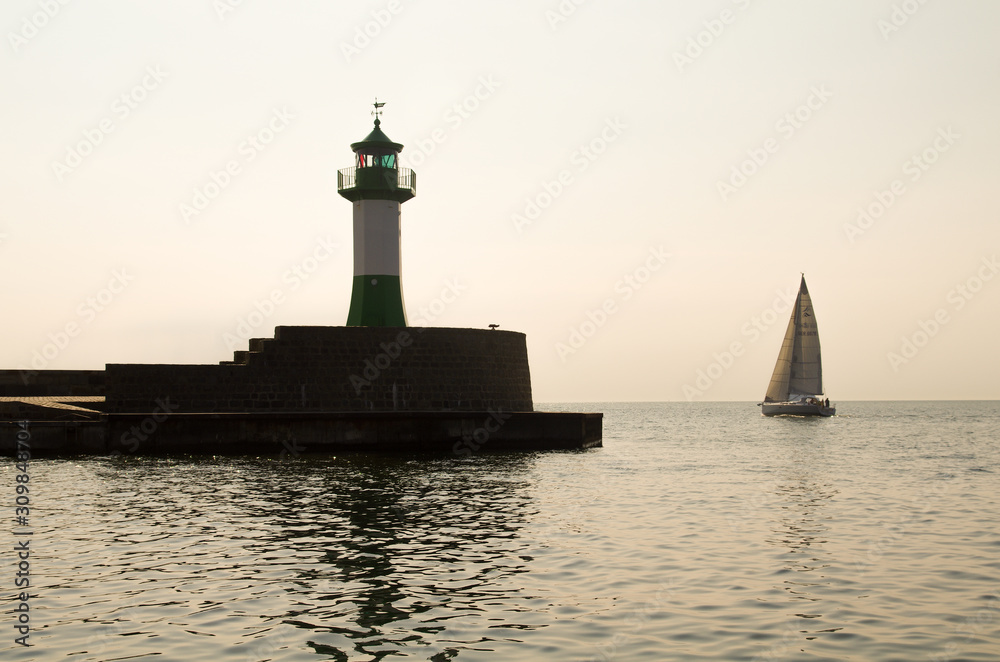sailing near lighthouse