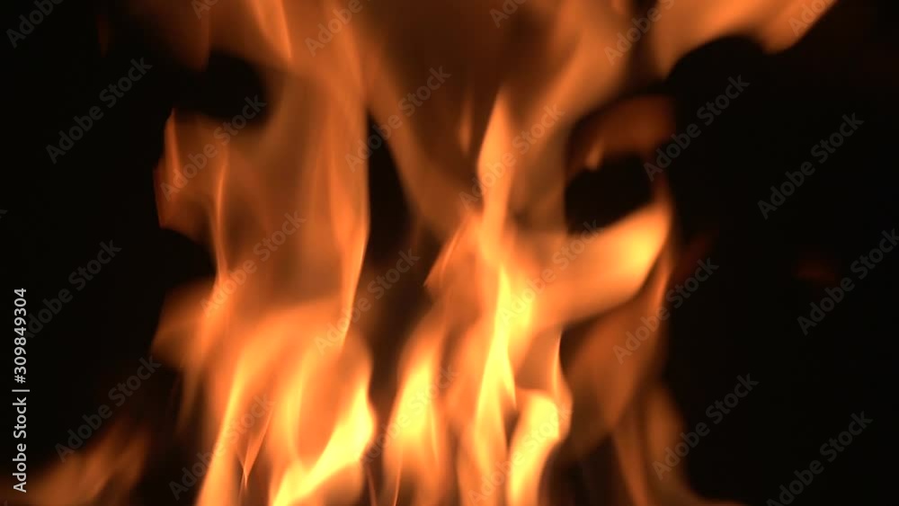 Bright flame in a fireplase on a black background Bright flame in a fireplase on a black background