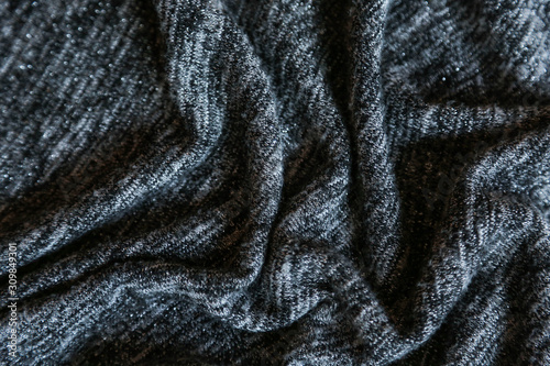  Grey cotton fabric background. Close up gray fabric texture background. wrinkled and shadows, selective focus top view