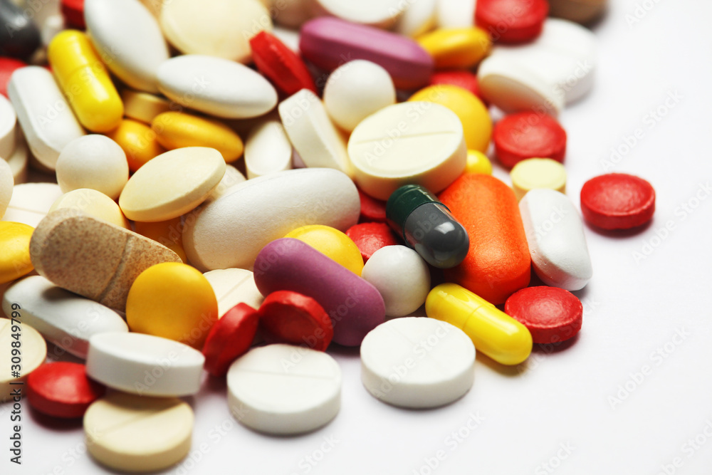 Different colorful tablets at white background Different colorful tablets at white background