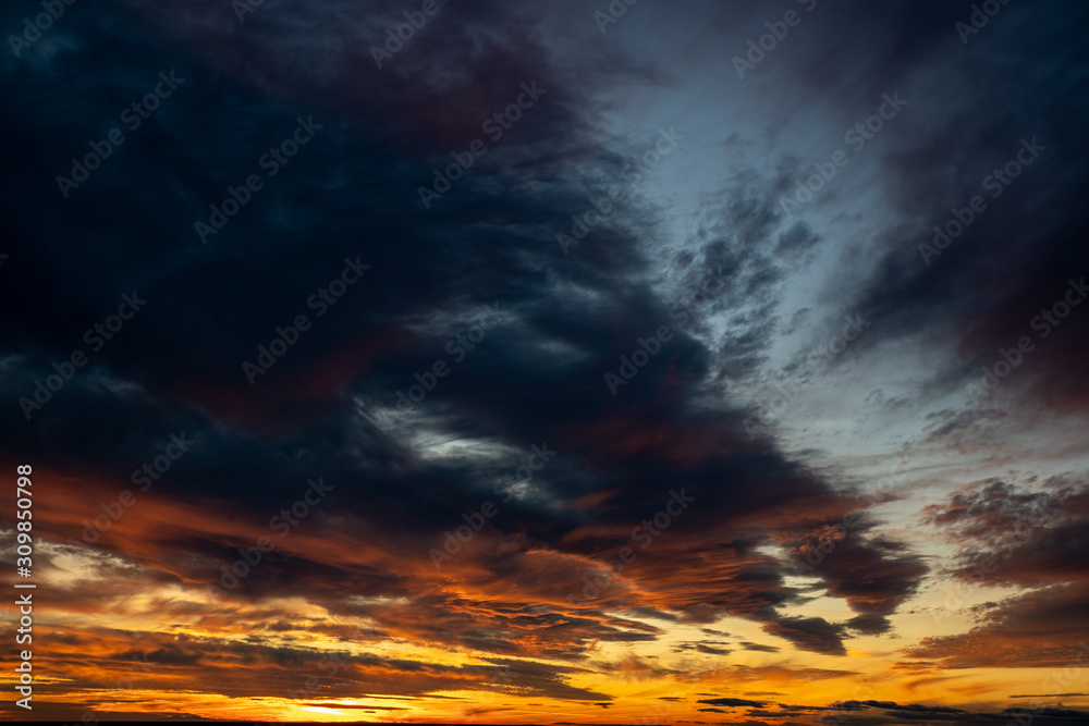 Sunset or Sunrise sky with orange and yellow colors. With beautiful clouds, perfect for sky replacement.