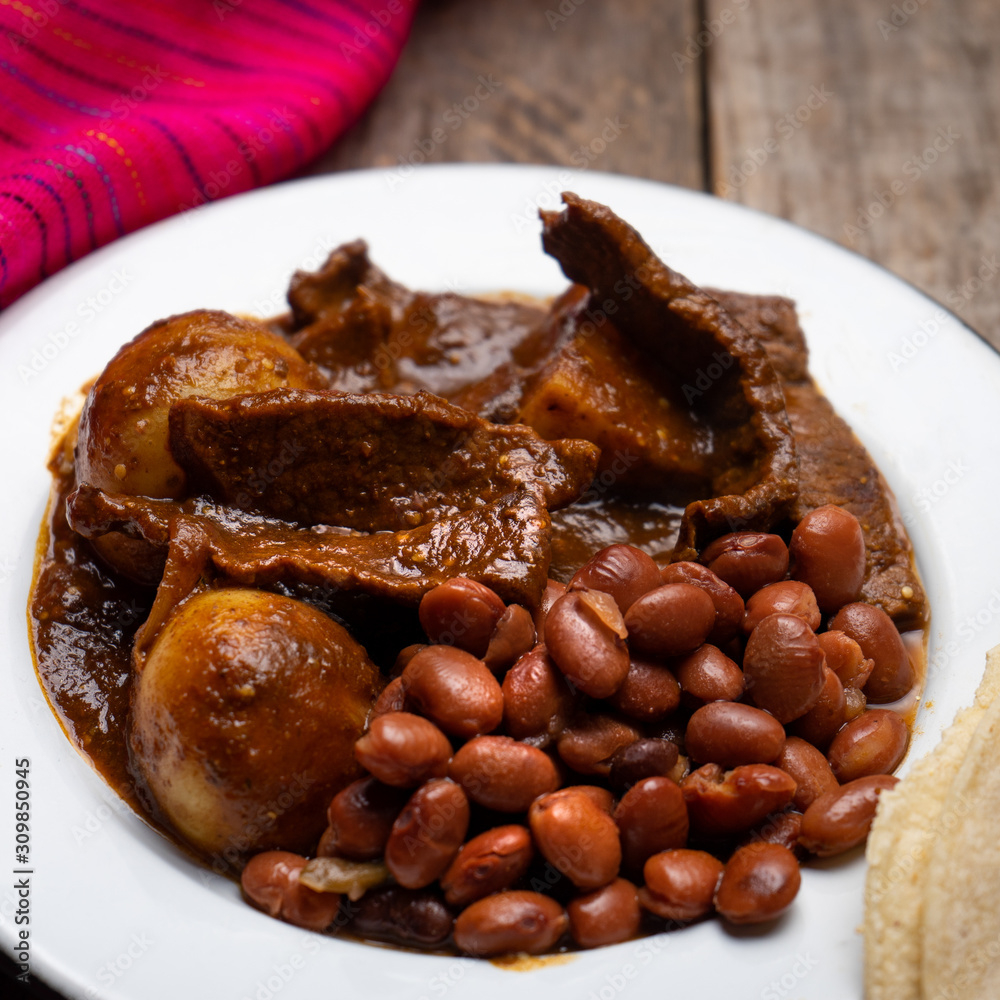 Mexican beef steak with potatoes and pasilla pepper sauce