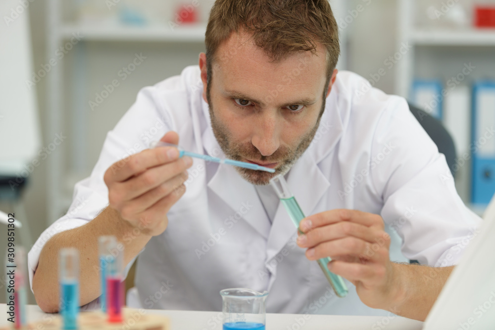 a lab technician analyzing sample a lab technician analyzing sample