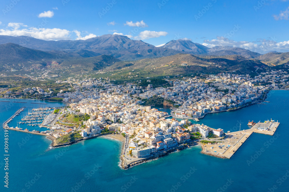 Agios Nikolaos,  a picturesque coastal town with colorful buildings around the port in the eastern part of the island Crete, Greece.