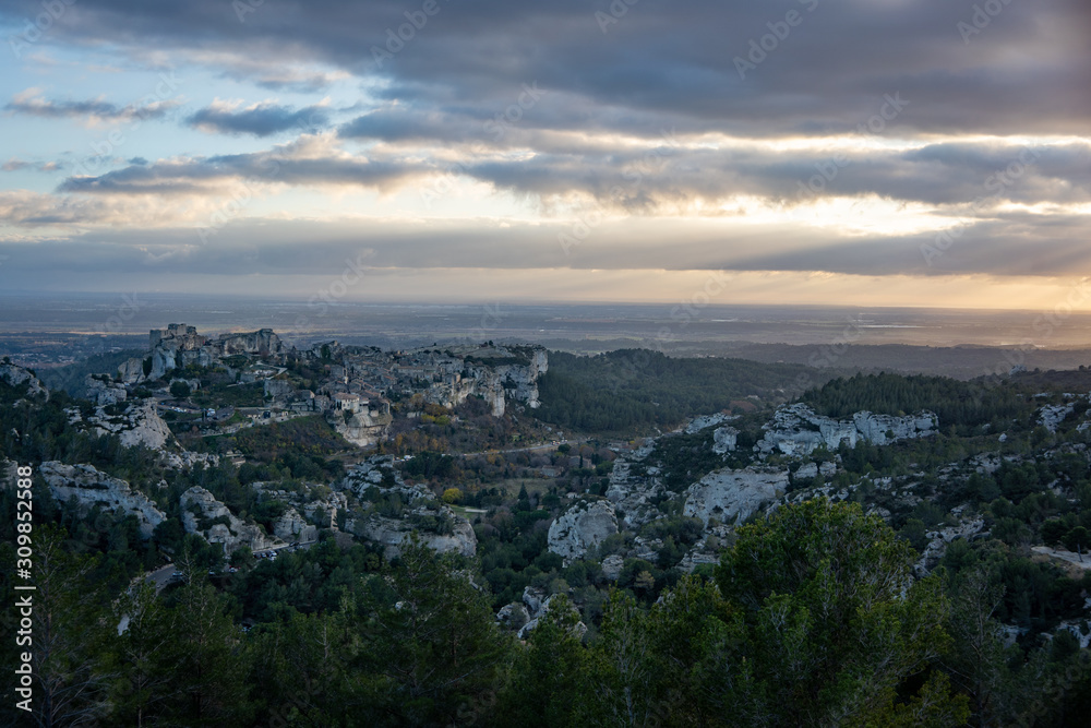 View of the Baux de Provence at sunset from a vantage point in the Alpilles at sunset, south of France.
