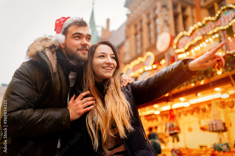 Young couple in Christmas market