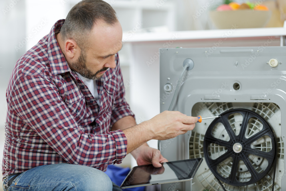 plumber fixing domestic washing machine plumber fixing domestic washing machine