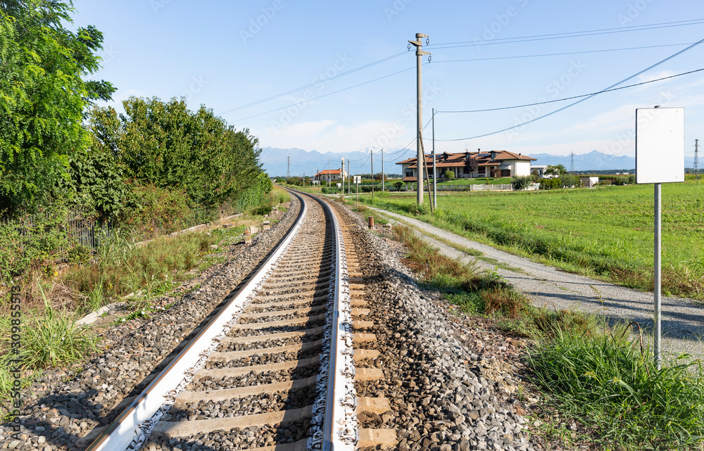 railway in the countryside next to Santhia city, province of Vercelli, Italy