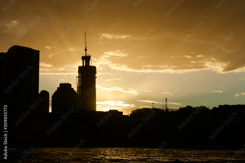 Sydney city skyline silhouette at sunset, New South Wales, Australia.