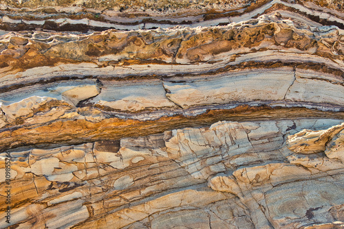 Colorful Striation in a shale rock wall photo