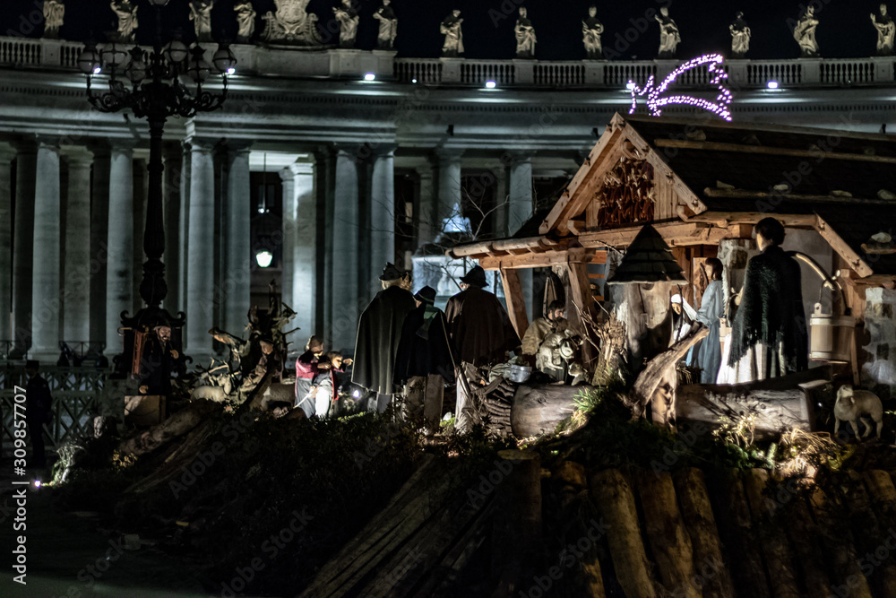Rome Italy; 8 December 2019. In Piazza San Pietro the nativity scene reproduced with the wood of Trentino. With the Christmas tree in the background.