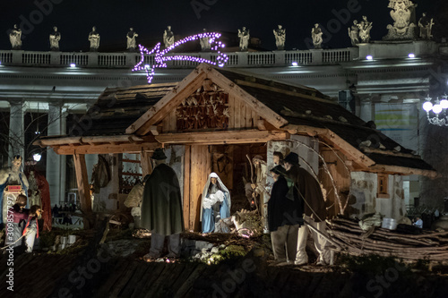 Wallpaper Mural Rome Italy; 8 December 2019. In Piazza San Pietro the nativity scene reproduced with the wood of Trentino. With the Christmas tree in the background. Torontodigital.ca