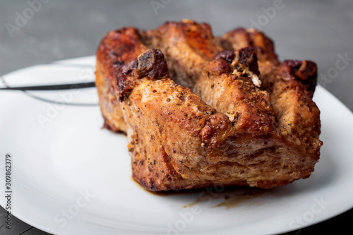 Roast pork loin on a white plate