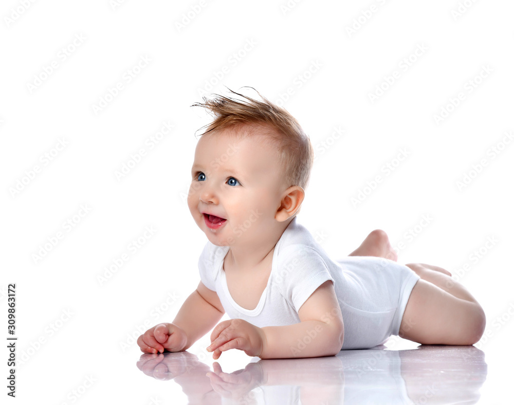 Infant child baby boy kid with blue eyes lying happy smiling screaming isolated on a white Infant child baby boy kid with blue eyes lying happy smiling screaming isolated on a white