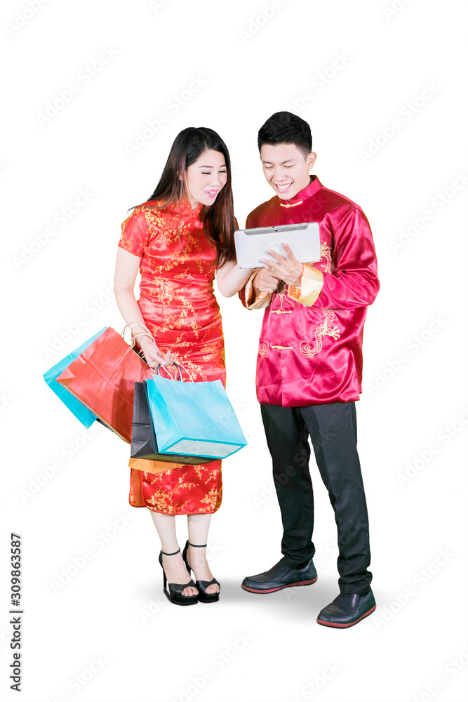 Asian man promoting some offerings to the woman Asian man promoting some offerings to the woman