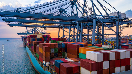 Canvas Print Aerial view container ship carrying container in import export business logistic and transportation of international by container ship in the open sea