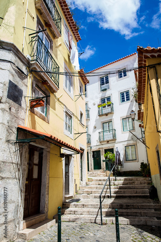 Beautiful old steepy streets at Lisbon city center photo