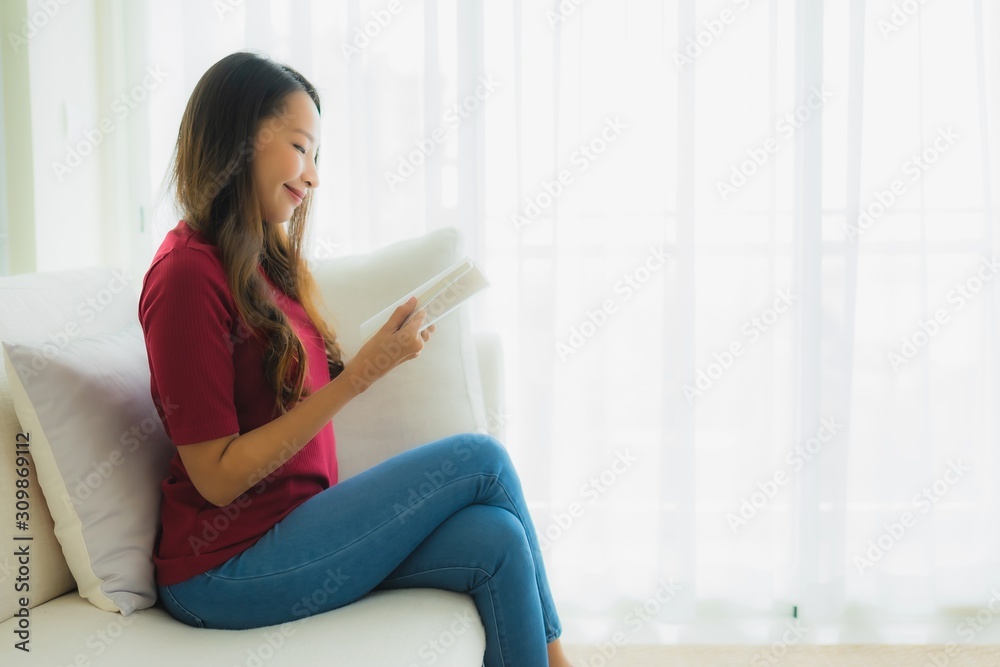 Portrait beautiful young asian women read book on sofa chair Portrait beautiful young asian women read book on sofa chair