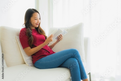 Portrait beautiful young asian women read book on sofa chair