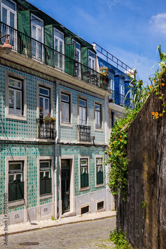 Beautiful old steepy streets at Lisbon city center photo