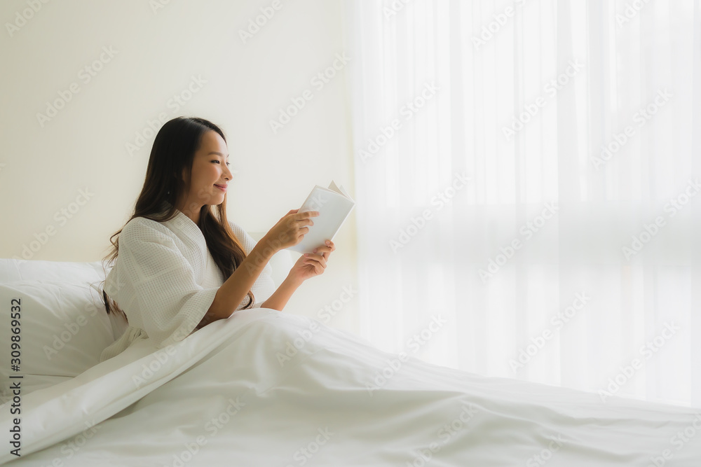 Portrait beautiful young asian women read book on bed Portrait beautiful young asian women read book on bed