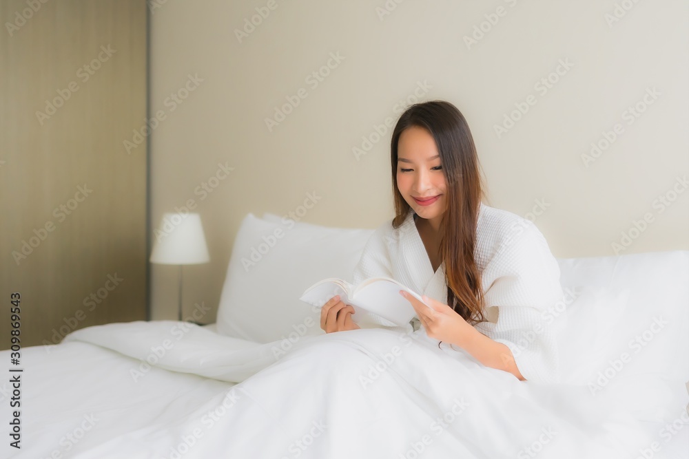 Portrait beautiful young asian women read book on bed