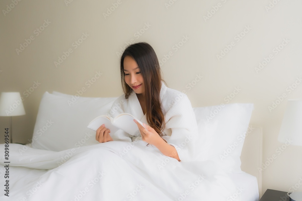 Portrait beautiful young asian women read book on bed Portrait beautiful young asian women read book on bed