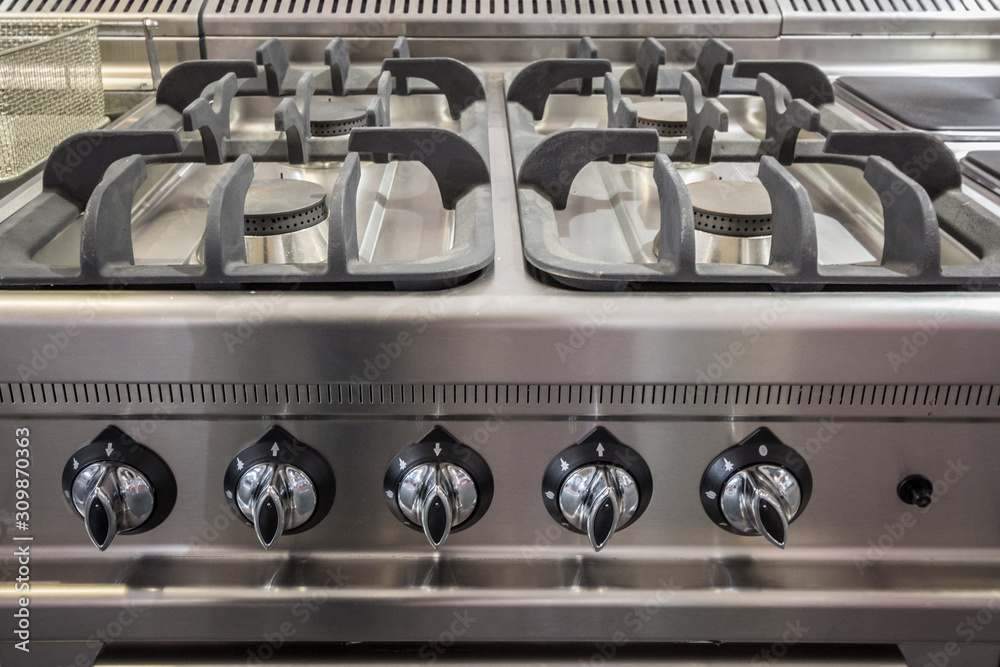 Foto Stock Gas stove, a professional one made of steel aluminium, on