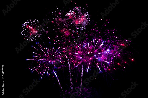 Colorful fireworks on black background for winter and new year festivals.