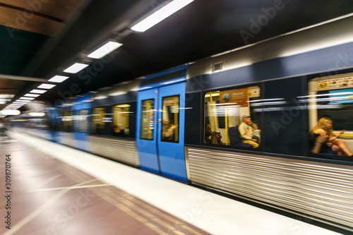 STOCKHOLM, SWEDEN - 22nd of May, 2014.Blurred view of a train at a subway station, Stockholm, Sweden photo