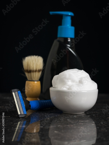 Gel for washing and shaving devices on a black background.