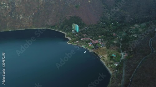 Aerial shot of Atitlan lake and a small town in Guatemala region of Sololá. 4k drone. photo