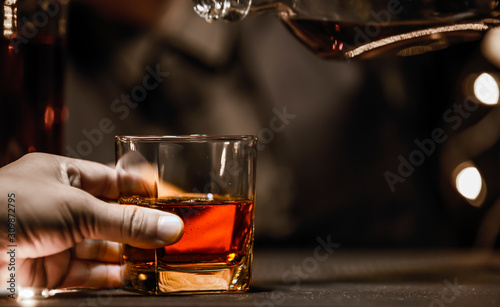 Bartender Serve Whiskey  on wood bar 