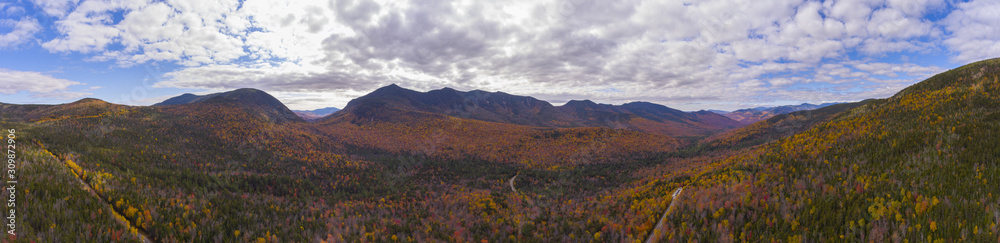 White Mountain National Forest fall foliage on Kancamagus Highway near Hancock Notch panorama aerial view, Town of Lincoln, New Hampshire NH, USA.