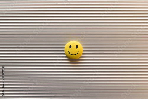 Funny smiley face on silver background. Positive mood concept.