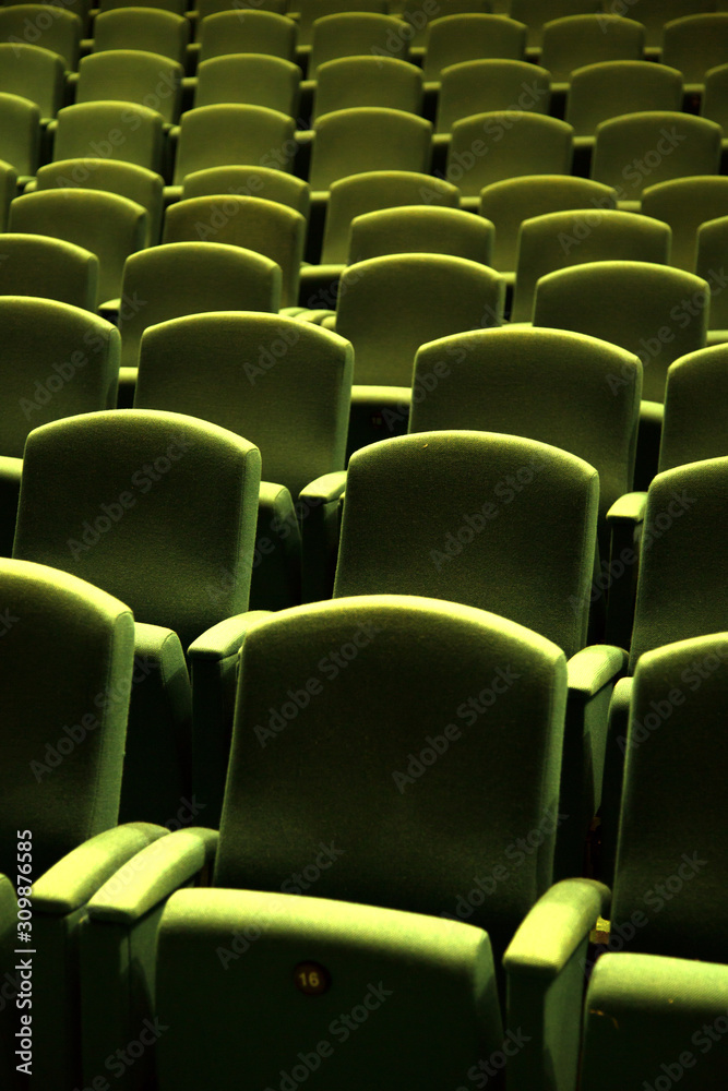 Obraz premium Green velvet seat in a theater