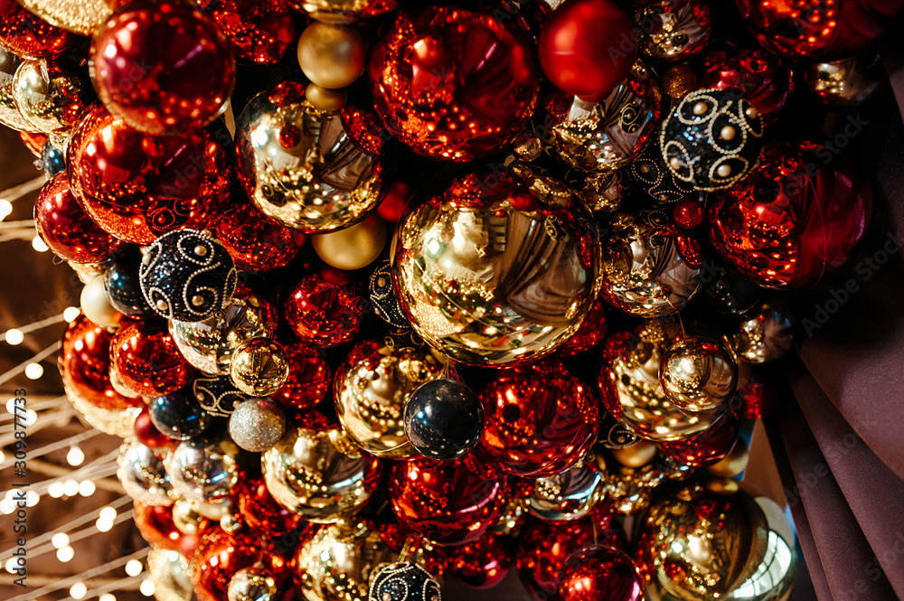 large number of large and small glass balls red and gold color , ceiling decoration for the holiday