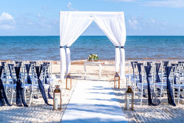 Blue themed wedding setup at the white sandy beach. Romantic getaway wedding. Horizontal