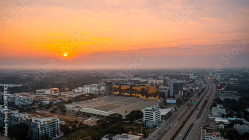 CHIANG MAI, THAILAND - DECEMBER 12, 2019 : Sunrise and office buildings of Chiang Mai in Thailand. Skyline view of cityscape with warm sunlight . Construction business concept.. © somchairakin