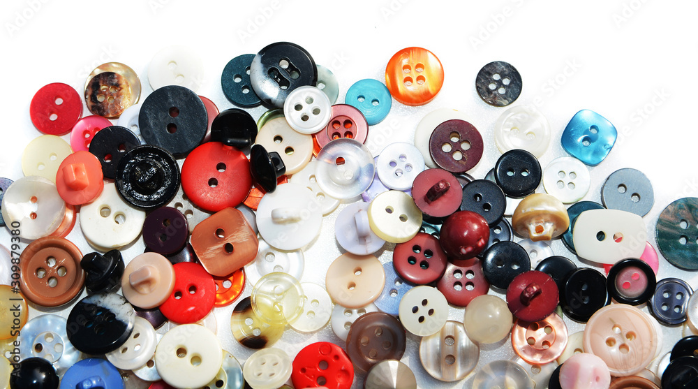 Multicolored sewing buttons on isolated background Multicolored sewing buttons on isolated background