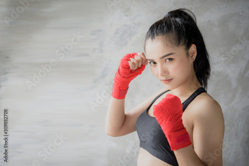 Girl in boxing training in the gym. © Subhakitnibhat