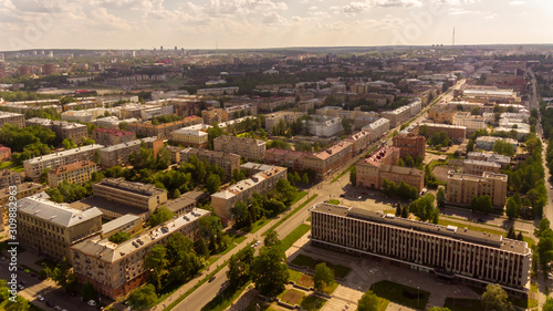 Aerial panorama of houses and avenues of city downtown in summer