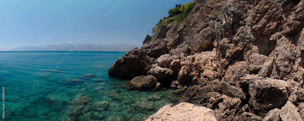 sunny summer day, rocky coast on the mediterranean sea, Antalya, Turkey