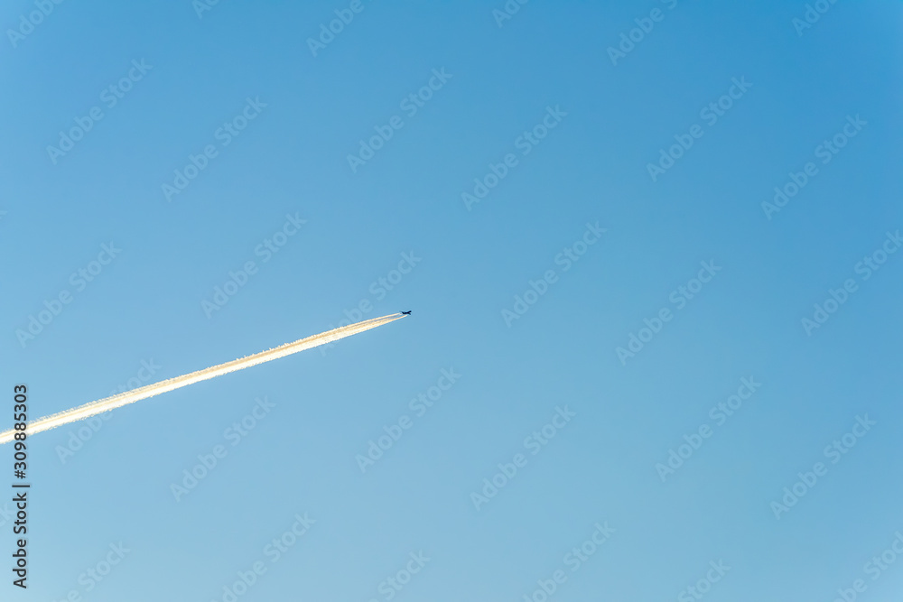 Jet plane flying through clouds at high altitude. Jet plane flying through clouds at high altitude.