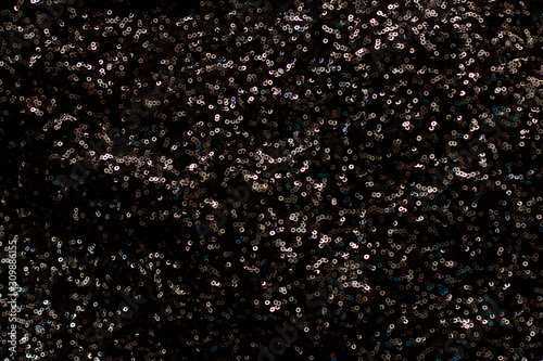 drops on glass black shiny sequins background 