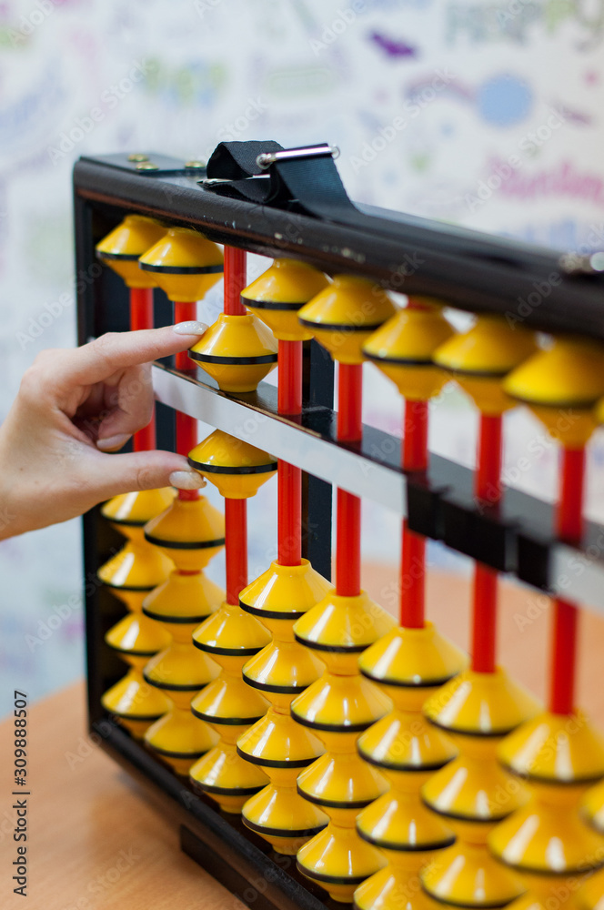 Naklejka premium hand with abacus