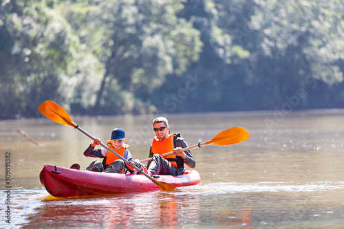 family canoeing together